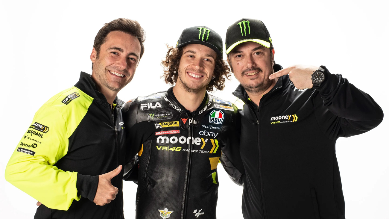 Marco Bezzecchi with VR46 team bosses after resigning for 2024